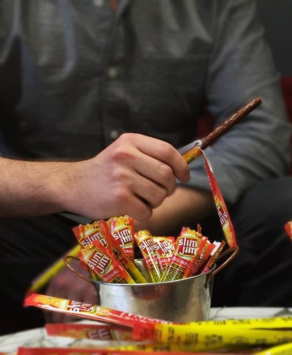 eating Slim Jim meat stick