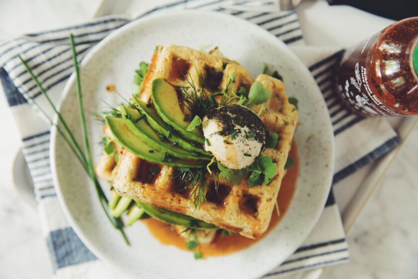  Green Waffles With Spinach, Onion, Vegan Cheese, and Sriracha Maple Syrup 