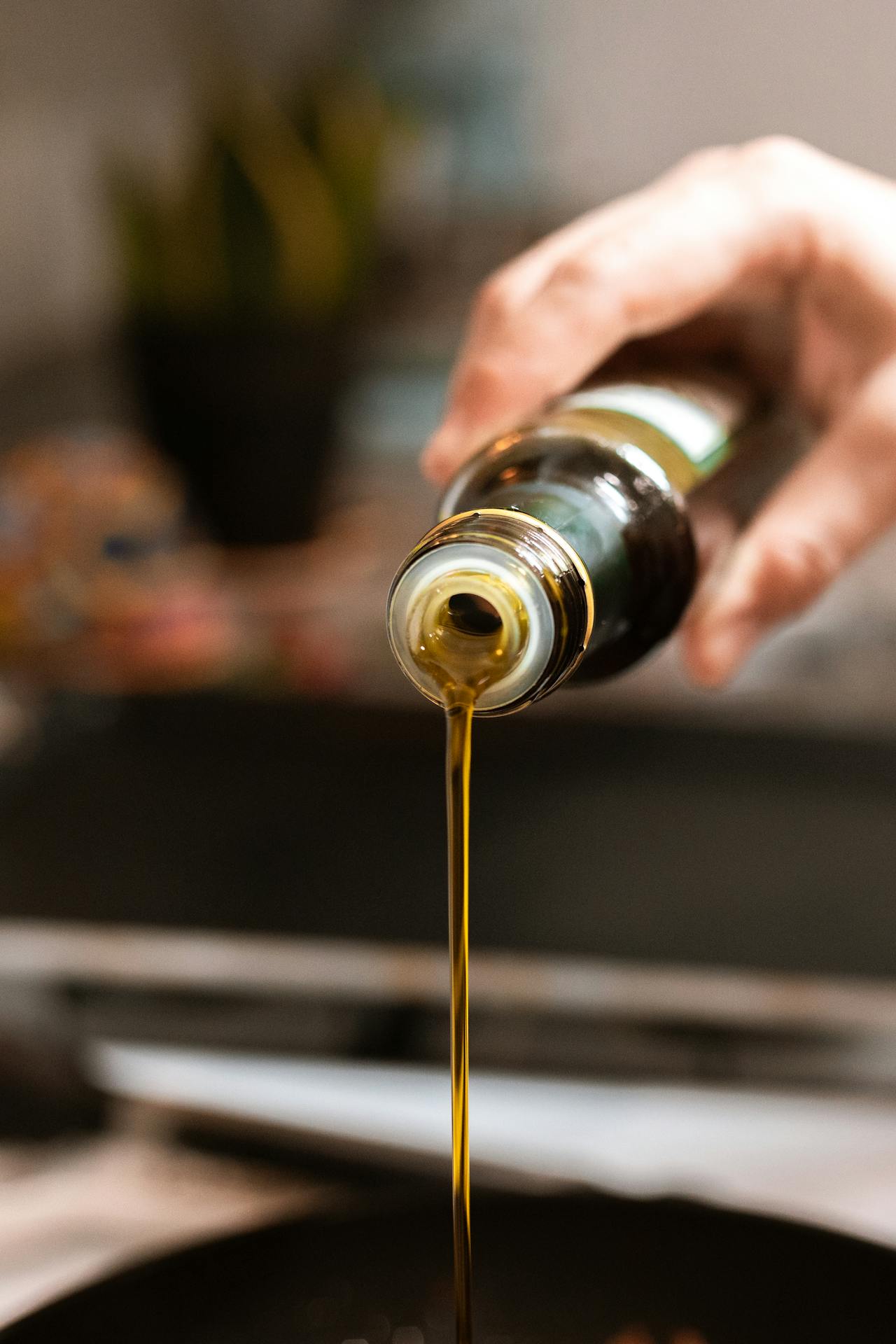 person pours oil