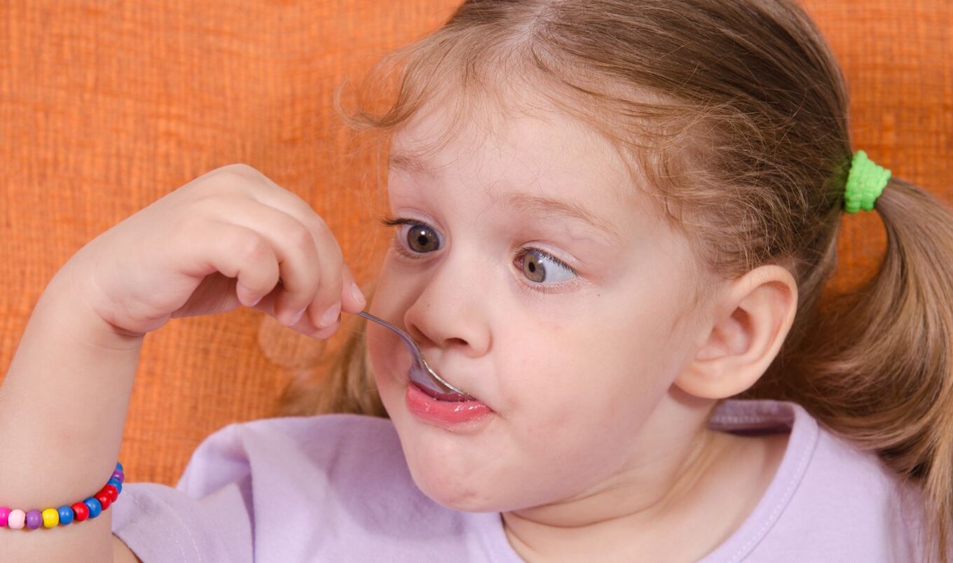 girl eating with spoon