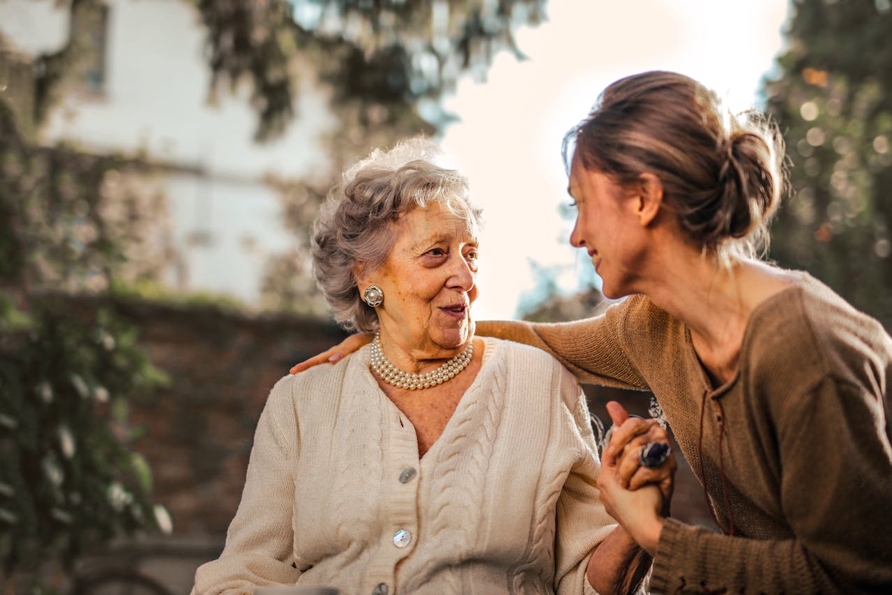 older woman talks to younger woman