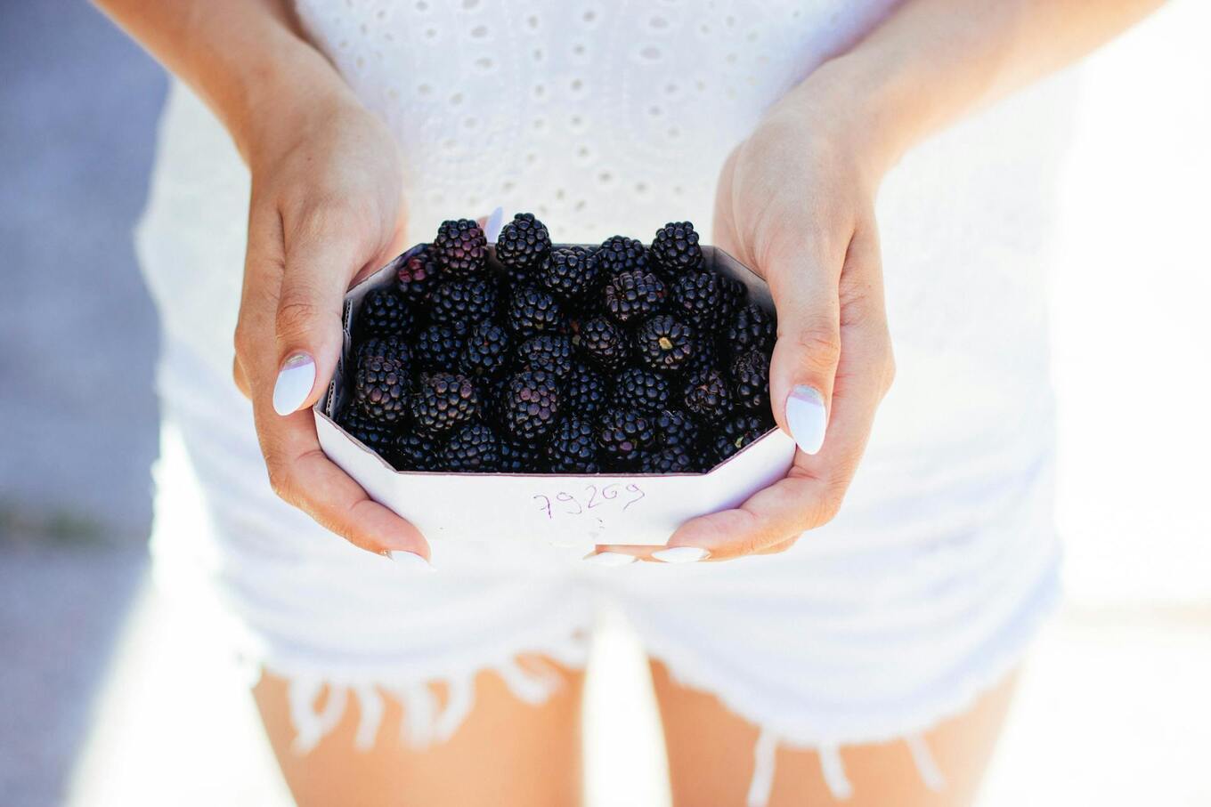 woman holding berries